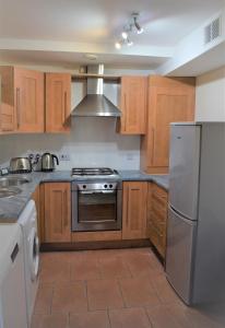 مطبخ أو مطبخ صغير في Airdrie Apartments