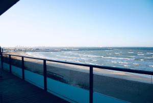 a view of the ocean from a boardwalk at Pirita Sea View Apartments One bedroom in Tallinn