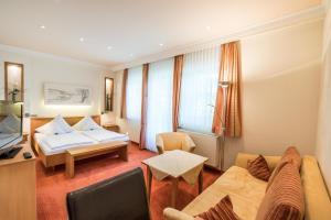 Ένα ή περισσότερα κρεβάτια σε δωμάτιο στο Hotel Hanses-Bräutigam +62 φωτογραφίες