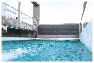 a swimming pool with blue water in a building at Rent Nuñez 2830 in Buenos Aires