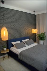 Giường trong phòng chung tại Last Floor Apartment - Krakow City Center close to Old Town