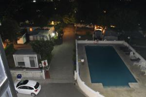 The swimming pool at or close to Hotel Arco Iris