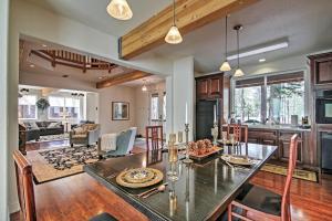 a kitchen and living room with a table and chairs at Luxurious South Lake Tahoe Lodge Less Than 2 Mi to Lake! in South Lake Tahoe