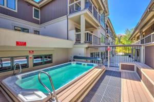 a swimming pool in the middle of a building at Walk to Ski Slopes and Main St Cozy Breck Condo! in Breckenridge