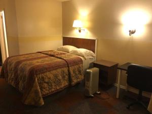 Postel nebo postele na pokoji v ubytování Hillcrest Motel