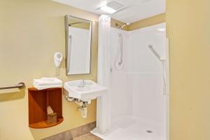 a bathroom with a sink and a shower at Windsor Hotel in East Windsor