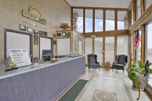 a waiting room with chairs and a reception desk at Days Inn by Wyndham Cartersville in Cartersville