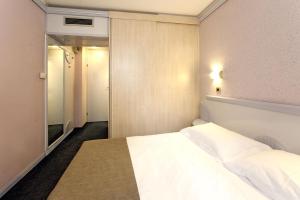 Ein Bett oder Betten in einem Zimmer der Unterkunft Hotel Plavi Plava Laguna