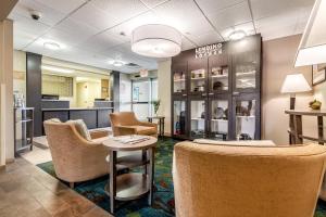 a waiting room at a dental office with chairs and a table at Candlewood Suites Lincoln, an IHG Hotel in Lincoln