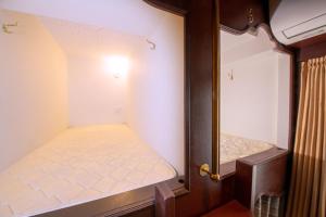 Postel nebo postele na pokoji v ubytování bnb+ Ueno Okachimachi