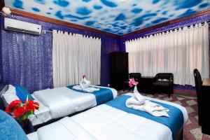 Katil atau katil-katil dalam bilik di Hotel Green Horizon