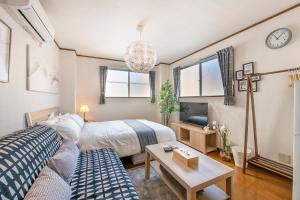 Postel nebo postele na pokoji v ubytování Uhome Ueno Apartment 4