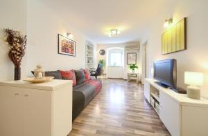 Televízia a/alebo spoločenská miestnosť v ubytovaní Apartment City Center