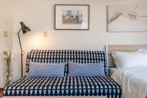 Postel nebo postele na pokoji v ubytování Uhome Ueno Apartment 4