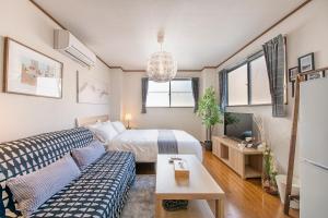 Postel nebo postele na pokoji v ubytování Uhome Ueno Apartment 4