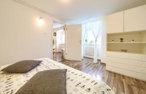 Posteľ alebo postele v izbe v ubytovaní Apartment City Center
