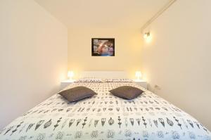 Posteľ alebo postele v izbe v ubytovaní Apartment City Center
