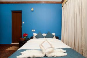 Katil atau katil-katil dalam bilik di Hotel Green Horizon