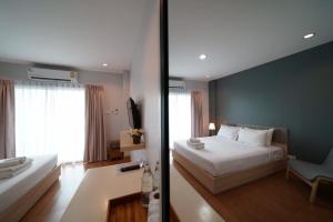 Voodi või voodid majutusasutuse Sukhothai Garden toas
