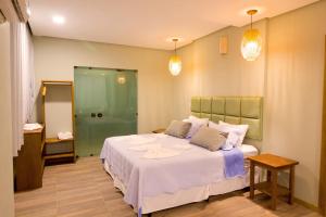Cama ou camas em um quarto em Pousada Vie