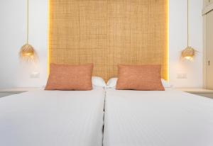 Posteľ alebo postele v izbe v ubytovaní Apartamentos Sinfony