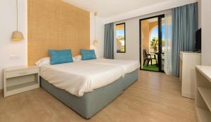 Posteľ alebo postele v izbe v ubytovaní Apartamentos Sinfony + 37 fotografií