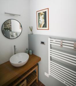 a bathroom with a white sink and a mirror at Little Room - Camera indipendente nella Torre in Pontassieve