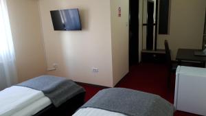 Μια τηλεόραση ή/και κέντρο ψυχαγωγίας στο Motel Diamant +32 φωτογραφίες