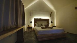 Postel nebo postele na pokoji v ubytování KALUME' Eco Boutique Resort-Adult only