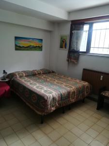 Una cama o camas en una habitación de Casa Ciliegia