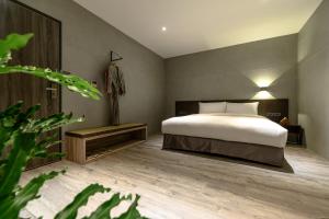 Letto o letti in una camera di Yunoyado Onsen Hot Spring Hotel Deyang