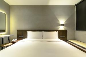 Letto o letti in una camera di Yunoyado Onsen Hot Spring Hotel Deyang