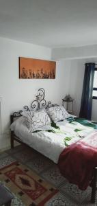 a bedroom with a large bed with at Dar Warda in Bizerte