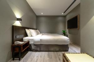 Letto o letti in una camera di Yunoyado Onsen Hot Spring Hotel Deyang