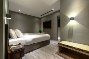 Letto o letti in una camera di Yunoyado Onsen Hot Spring Hotel Deyang