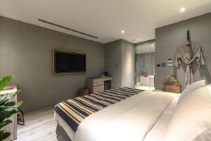 Letto o letti in una camera di Yunoyado Onsen Hot Spring Hotel Deyang