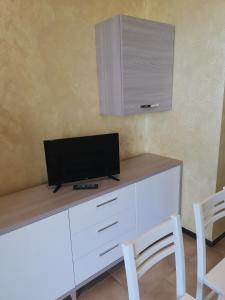 TV a/nebo společenská místnost v ubytování La Terrazza sul Mare