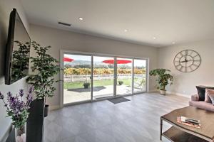 a living room with a couch and a table at Beautiful Sonoma House with Patio and Vineyard Views! in Sonoma