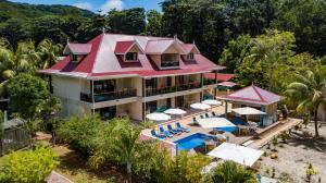 an aerial view of a resort with a swimming pool at CocoLux Luxury Apartments in La Digue