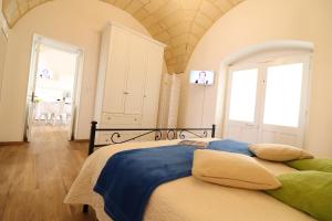 Posteľ alebo postele v izbe v ubytovaní Glenda Historic House in Otranto