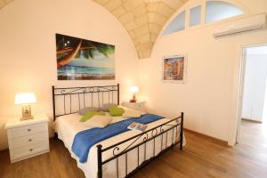 Posteľ alebo postele v izbe v ubytovaní Glenda Historic House in Otranto