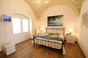 Posteľ alebo postele v izbe v ubytovaní Glenda Historic House in Otranto