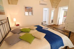 Posteľ alebo postele v izbe v ubytovaní Glenda Historic House in Otranto