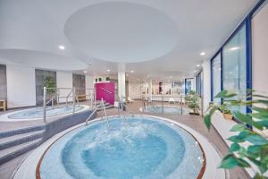 a hot tub in the middle of a building at Sandos Papagayo in Playa Blanca