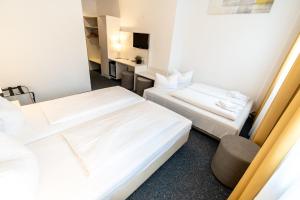 Postel nebo postele na pokoji v ubytování Hotel Wandinger Hof by Lehmann Hotels