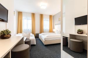 Postel nebo postele na pokoji v ubytování Hotel Wandinger Hof by Lehmann Hotels