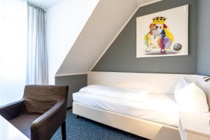 Postel nebo postele na pokoji v ubytování Hotel Wandinger Hof by Lehmann Hotels