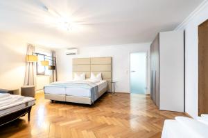 Postel nebo postele na pokoji v ubytování Hotel Wandinger Hof by Lehmann Hotels
