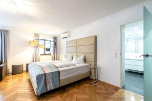 Postel nebo postele na pokoji v ubytování Hotel Wandinger Hof by Lehmann Hotels