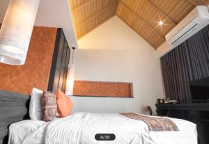 Postel nebo postele na pokoji v ubytování Tapae Gate Villa